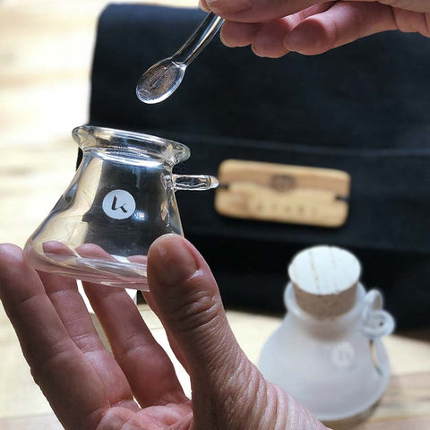 Hand-blown apothecary glass jar and glass spoon