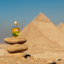 Katari Hoba jojoba oil on stacked stones in front of the pyramids of Giza