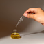 Glass dauber lifted from a hand-blown bottle of Katari Amour d'été perfume oil