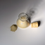 Open hand-blown glass jar of Katari Argil green clay powder with its cork, top view