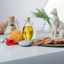 Katari Belle Voyaj ritual on a vanity with a Bastet statue, sea sponge and olivewood spatula