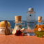 Katari Belle Voyaj kit lined up on a terracotta terrace above the Mediterranean Sea