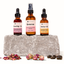 Katari First Ritual trio on stone with dried rose petals, rosebuds and jojoba seeds