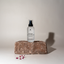 Katari Geran geranium flower water on a stone block with dried petals