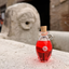 Katari Granate pomegranate seed oil in a hand-blown glass amphora on ancient carved stone