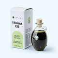 Katari Henna Oil for hair, brow, and lash growth in a hand-blown glass amphora and 1 oz box.