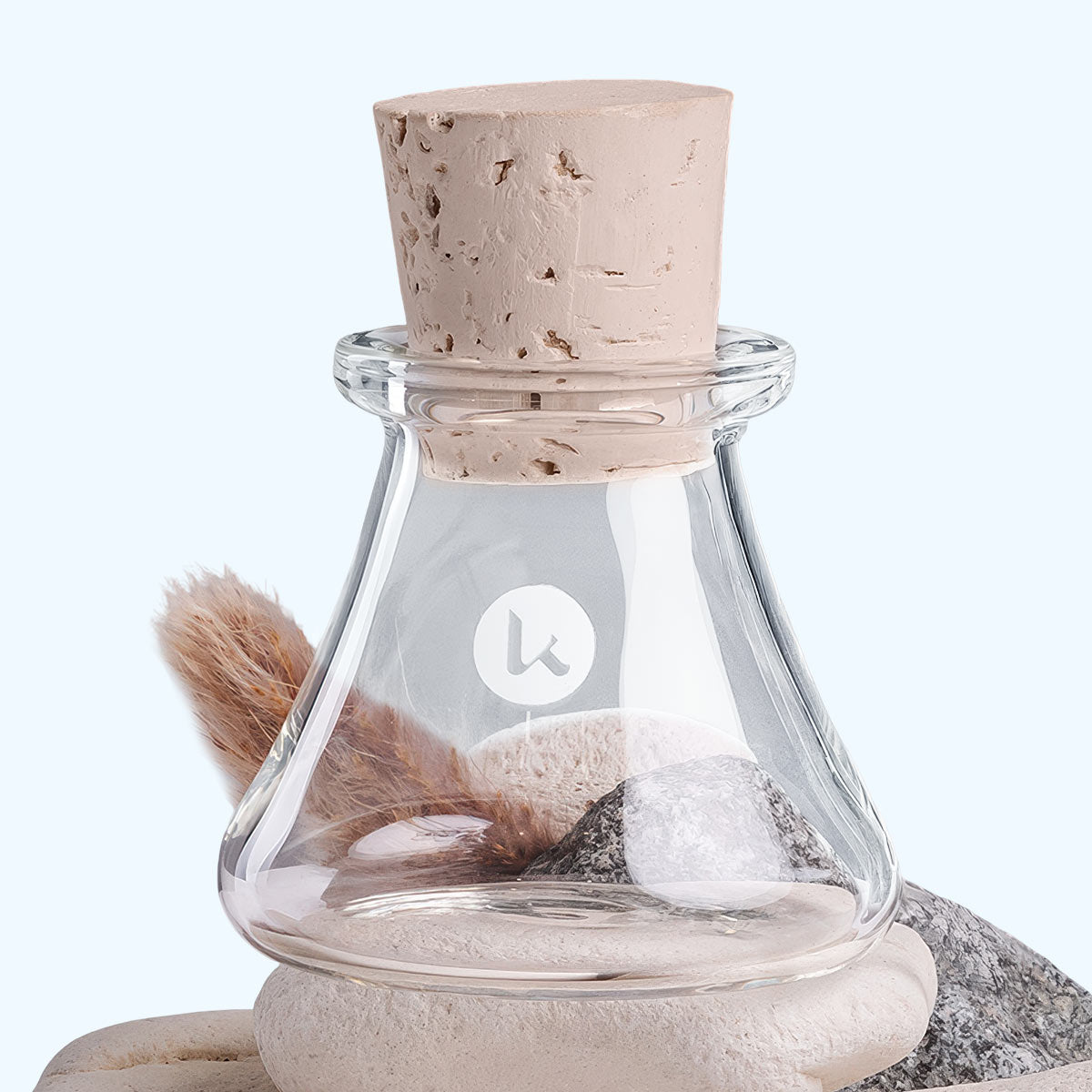 Hand blown glass jar with cork stopper on a light gray background - 1 oz
