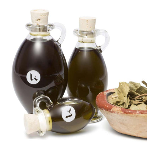 Pure, cold-pressed henna oil in a hand-blown glass amphoras