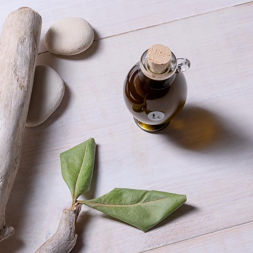 Pure, cold-pressed henna oil in a hand-blown glass amphora - top view